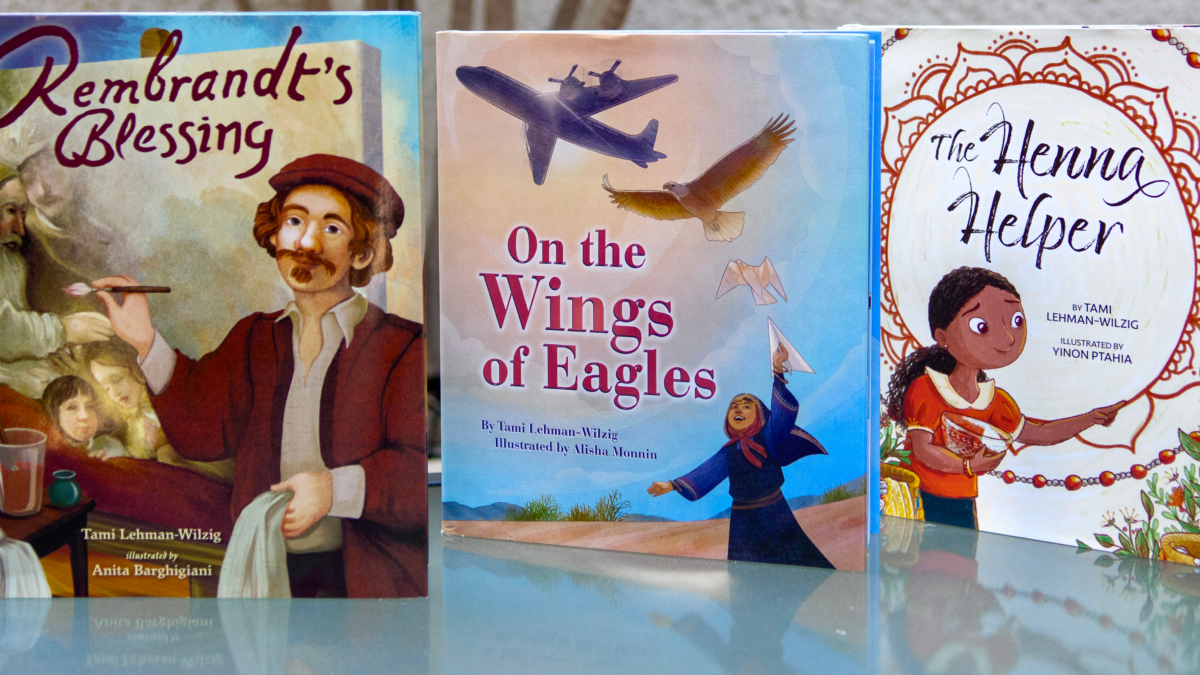 The image contains three hardcover books, "On the Wings of Eagles", "Rembrandt's Blessing". and "The Henna Helper".